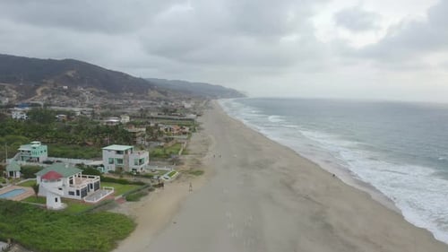 Aerial view of a beach at the shoreline of the Pacific Ocean in Ecuador