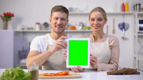 Cheerful Couple Holding Tablet With Green Screen, Online Food Shopping Template