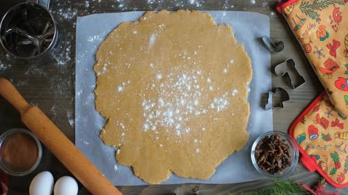 Topdown View Flour Falling on Traditional Christmas Cookies