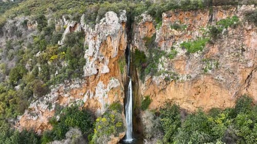 Waterfall in the mountains aerial view 4 K