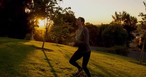 Athletic Woman Running Up A Hill Slow-Motion