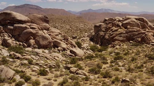 Aerial shot of interesting rock formations in the desert of California